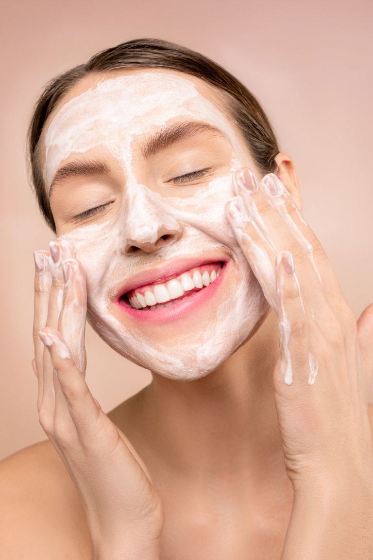 woman-with-white-facial-soap-on-face