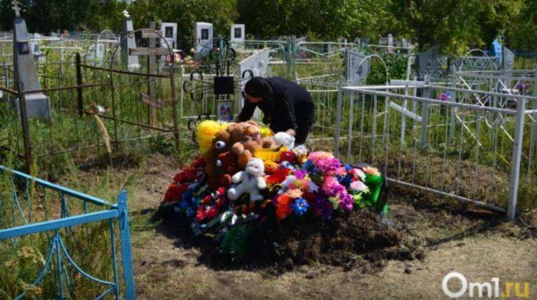Flowers and tributes on the boy's gravesite