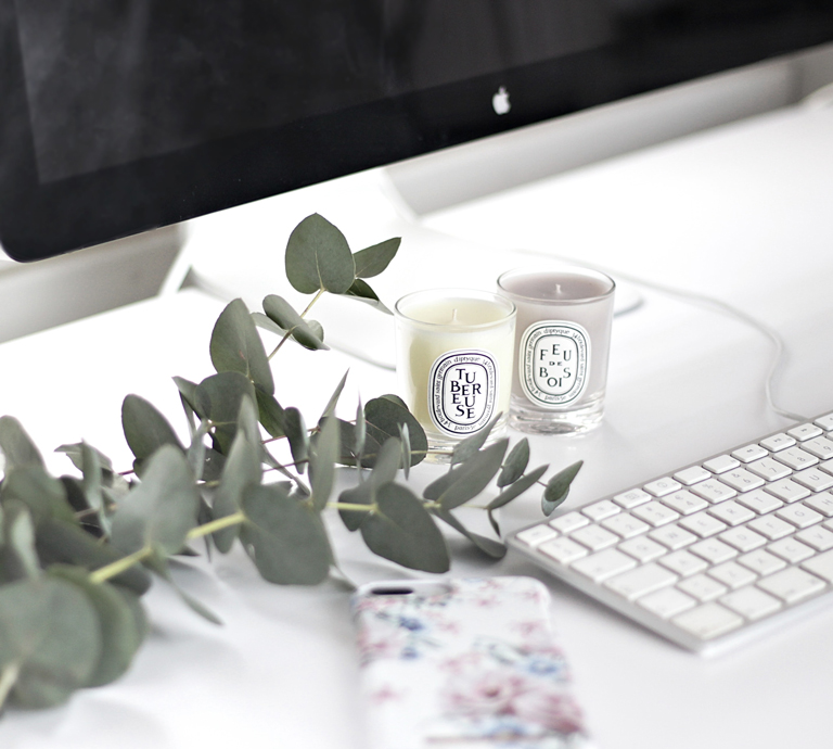 Minimalistic-interior-with-iMac-and-Diptyque-scented-candles