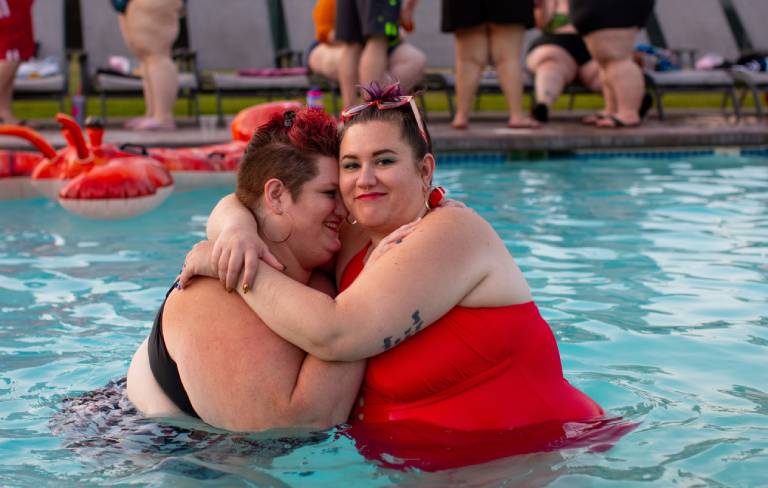 Plus size couple at pool party