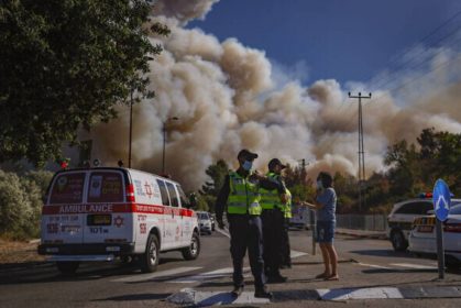 Emergency services at the site of a fire which broke out in a forest near Beit Meir, outside of Jerusalem