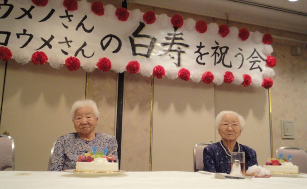 Koume (left) and Umeno (right) celebrating their 99th birthday